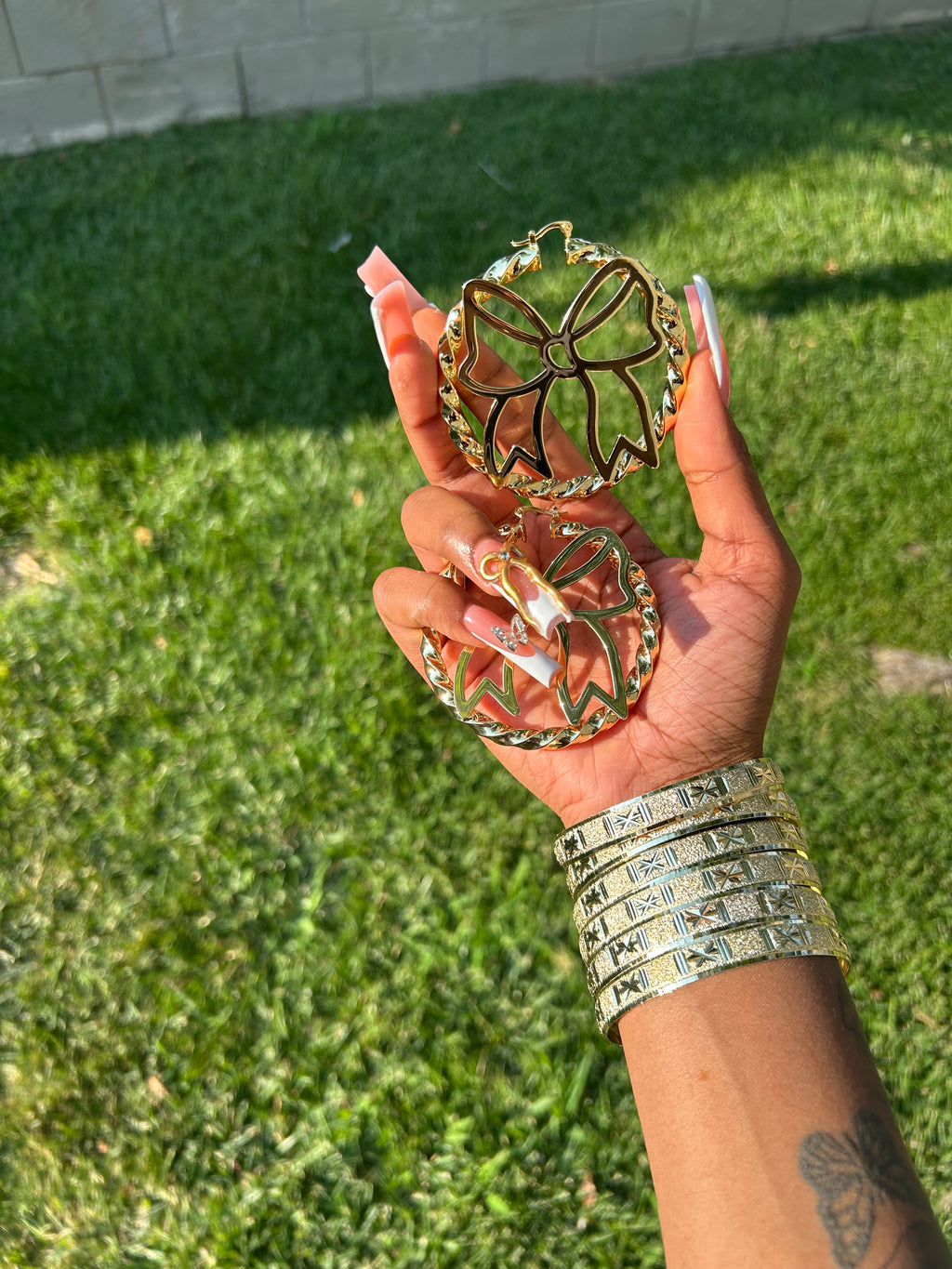 Bow Symbol Gold Hoops